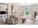 Cozy living room with neutral tones, stylish decor, and a bright window view at 1150 Collier Nw Rd # D20, Atlanta, GA 30318