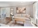 Comfortable living room featuring a sofa, modern art, and dark laminate wood flooring at 1150 Collier Nw Rd # D20, Atlanta, GA 30318