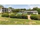 Apartment complex featuring a refreshing swimming pool surrounded by lush greenery at 1150 Collier Nw Rd # D20, Atlanta, GA 30318