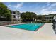 Apartment complex featuring fenced swimming pool and lounge area at 1150 Collier Nw Rd # D20, Atlanta, GA 30318