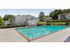 Apartment complex featuring fenced swimming pool surrounded by manicured lawn at 1150 Collier Nw Rd # D20, Atlanta, GA 30318