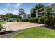 Apartment complex featuring a sand volleyball court and bench at 1150 Collier Nw Rd # D20, Atlanta, GA 30318
