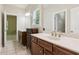 Bathroom with double vanity, tile floor, and separate toilet room at 2434 Soft Maple St, Atlanta, GA 30360