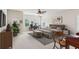 Spacious bedroom with large windows, a ceiling fan, and an ensuite desk area with lots of natural light at 2434 Soft Maple St, Atlanta, GA 30360