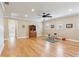 Large bonus room with hardwood floors, ceiling fan, and natural light at 2434 Soft Maple St, Atlanta, GA 30360