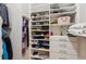 Well-organized walk-in closet with shelves, drawers, and ample hanging space at 2434 Soft Maple St, Atlanta, GA 30360