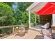 Outdoor deck area with cocktail seating and a vibrant view of the surrounding greenery at 2434 Soft Maple St, Atlanta, GA 30360