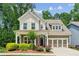 Charming two-story home with a beautifully landscaped front yard and attached garage at 2434 Soft Maple St, Atlanta, GA 30360