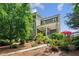 Beautiful home exterior showcasing the back porch and patio area, surrounded by lush landscaping at 2434 Soft Maple St, Atlanta, GA 30360