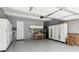 Well-organized garage with ample storage cabinets, work bench, and epoxied flooring at 2434 Soft Maple St, Atlanta, GA 30360