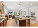 Open-concept kitchen with a granite island, modern appliances, and seamless access to the living area at 2434 Soft Maple St, Atlanta, GA 30360