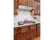 Close-up view of the kitchen features, including stainless steel range hood and gas cooktop at 2434 Soft Maple St, Atlanta, GA 30360