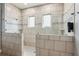 Large walk-in shower with tiled walls, dual shower heads, and glass enclosures at 2434 Soft Maple St, Atlanta, GA 30360