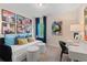 Bright bedroom featuring a daybed, desk, and colorful abstract art at 320 Navigator Ln, Mcdonough, GA 30253