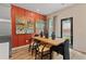 Dining area with contemporary table and chairs next to the kitchen area at 320 Navigator Ln, Mcdonough, GA 30253
