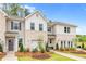 New townhomes with siding and brick exteriors, beautiful landscaping and craftsman style details at 320 Navigator Ln, Mcdonough, GA 30253