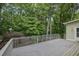 Spacious deck with wood railings offers a peaceful outdoor retreat at 4047 Watkins Glen Dr, Woodstock, GA 30189