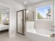 Bathroom featuring a glass enclosed shower and a soaking tub at 4060 Andover Cir, Mcdonough, GA 30252