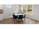 Bright breakfast nook features natural light and a stylish marble table and seating for six at 4060 Andover Cir, Mcdonough, GA 30252