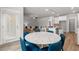 The breakfast nook offers natural light and a stylish marble table and seating, adjacent to the kitchen at 4060 Andover Cir, Mcdonough, GA 30252