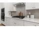 Modern kitchen features stainless steel appliances, gas cooktop, and stylish tile backsplash at 4060 Andover Cir, Mcdonough, GA 30252