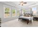 A bright and airy main bedroom featuring tray ceiling and lots of natural light at 4060 Andover Cir, Mcdonough, GA 30252