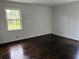 Bedroom featuring hardwood floors, freshly painted walls, and natural light at 5460 Huron Dr, Morrow, GA 30260