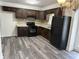 Bright kitchen featuring granite counters, a black range, and wood cabinets at 5460 Huron Dr, Morrow, GA 30260