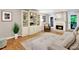 Inviting living room featuring a fireplace, built-in shelving, and comfortable seating at 701 Dunwoody Chace, Atlanta, GA 30328