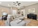 Comfortable living room includes modern furnishings, wood floors, and a ceiling fan for a relaxing space at 701 Dunwoody Chace, Atlanta, GA 30328