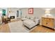 Cozy living room with fireplace, neutral sectional sofa, and hardwood floors at 701 Dunwoody Chace, Atlanta, GA 30328