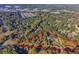 Aerial view highlighting property boundaries and mature trees surrounding a beautiful home at 1445 Hillside Dr, Grayson, GA 30017