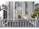 A serene back deck perfect for gatherings, featuring a stainless steel grill, elegant white railings, and a glimpse of outdoor living at 1445 Hillside Dr, Grayson, GA 30017