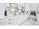 Elegant primary bathroom with marble floors, double sink vanity, and decorative bronze finishes at 1445 Hillside Dr, Grayson, GA 30017