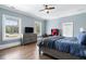 Bedroom with hardwood floors and natural light from the large windows at 1445 Hillside Dr, Grayson, GA 30017