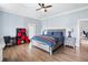 Bedroom featuring hardwood floors, desk, and a ceiling fan at 1445 Hillside Dr, Grayson, GA 30017