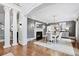 Elegant dining room with fireplace, wainscoting, hardwood floors and staircase access at 1445 Hillside Dr, Grayson, GA 30017