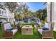 Outdoor fire pit with comfortable seating area surrounded by lush greenery, creating a warm and inviting space for relaxation at 1445 Hillside Dr, Grayson, GA 30017