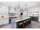 Gourmet kitchen with island, stainless steel appliances, and custom cabinets at 1445 Hillside Dr, Grayson, GA 30017