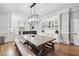 Open layout kitchen with island, dining table and chairs with built in cabinets at 1445 Hillside Dr, Grayson, GA 30017