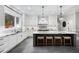 Bright kitchen boasts a large island, white cabinets, pendant lights, and modern appliances at 1445 Hillside Dr, Grayson, GA 30017