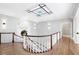 Bright landing featuring stained glass window and hardwood floors at 1445 Hillside Dr, Grayson, GA 30017