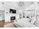 Relaxing main bedroom featuring a fireplace and seating area at 1445 Hillside Dr, Grayson, GA 30017