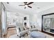 Sitting area adjacent to main bedroom featuring chairs and a large mirror at 1445 Hillside Dr, Grayson, GA 30017