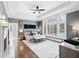 Large main bedroom features tray ceiling, fireplace, and large windows, all with hardwood floors at 1445 Hillside Dr, Grayson, GA 30017