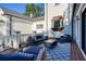 Cozy outdoor seating area with plush cushions, a coffee table, and a stylish rug, ideal for lounging and entertaining guests at 1445 Hillside Dr, Grayson, GA 30017
