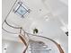 Close-up of the curved staircase and stained glass window adding elegance to the entryway at 1445 Hillside Dr, Grayson, GA 30017