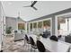 Sun-drenched room featuring dual seating areas, tile floors and access to an outdoor patio at 1445 Hillside Dr, Grayson, GA 30017