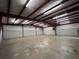 Large warehouse interior with concrete floor, metal walls, and high ceilings, perfect for storage or industrial use at 1445 Hillside Dr, Grayson, GA 30017