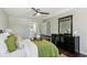 Comfortable bedroom with a ceiling fan, ensuite bathroom access, and a large dresser at 2284 Briarwood Cir, Conyers, GA 30094